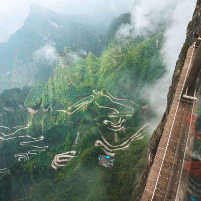 people on glass walk at Tianmen mountain in zhangjiajie